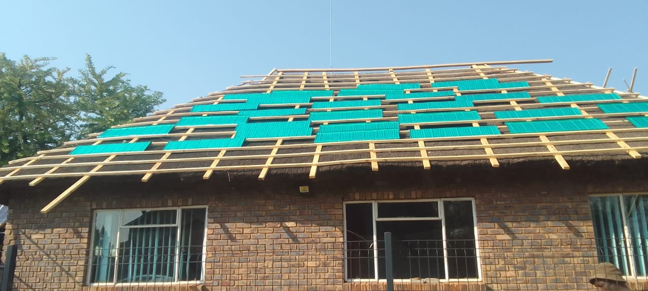 Thatch roof being battened in preparation for Harvey thatch tiles